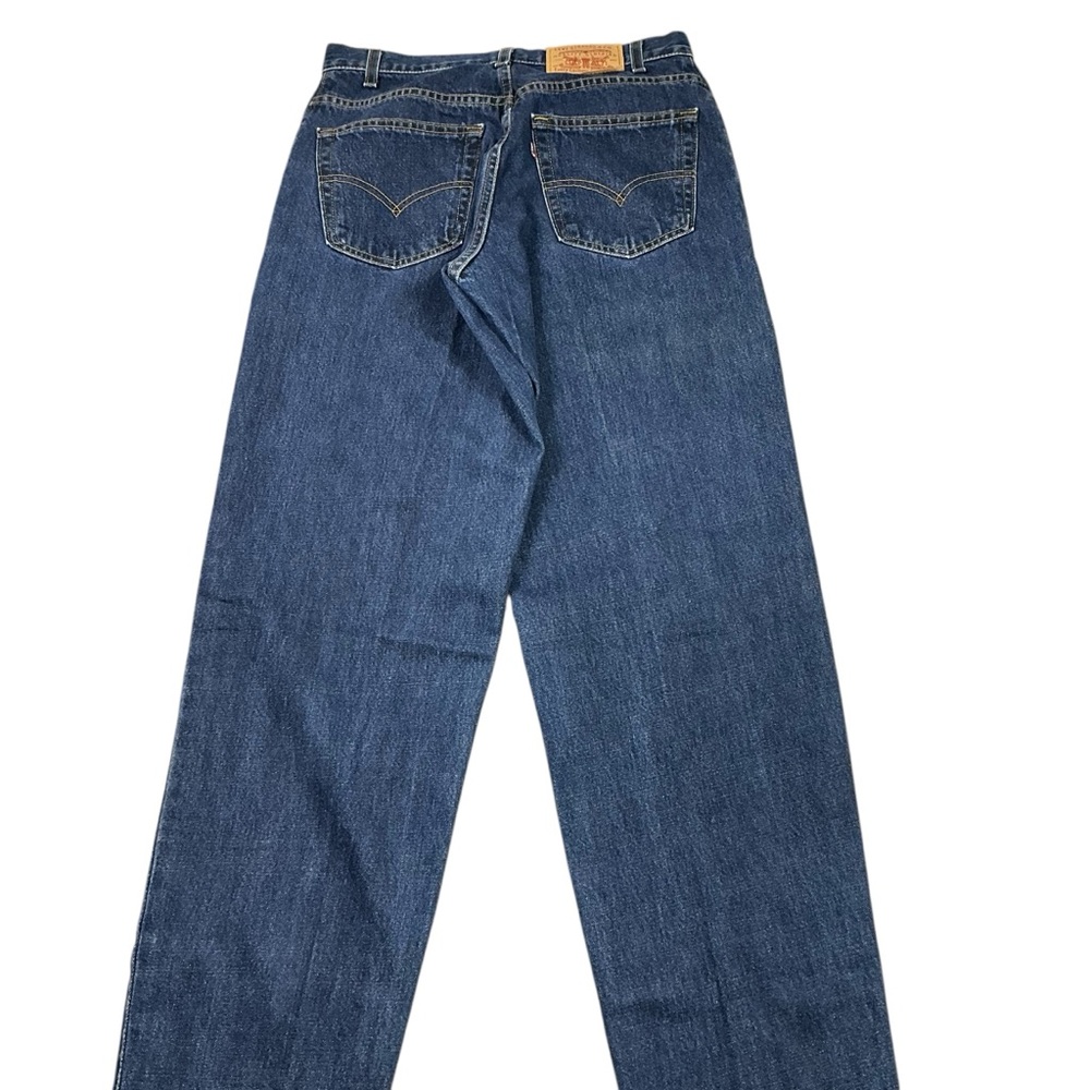 Vintage Levi’s 560 90s dark wash loose fit jeans 29x36